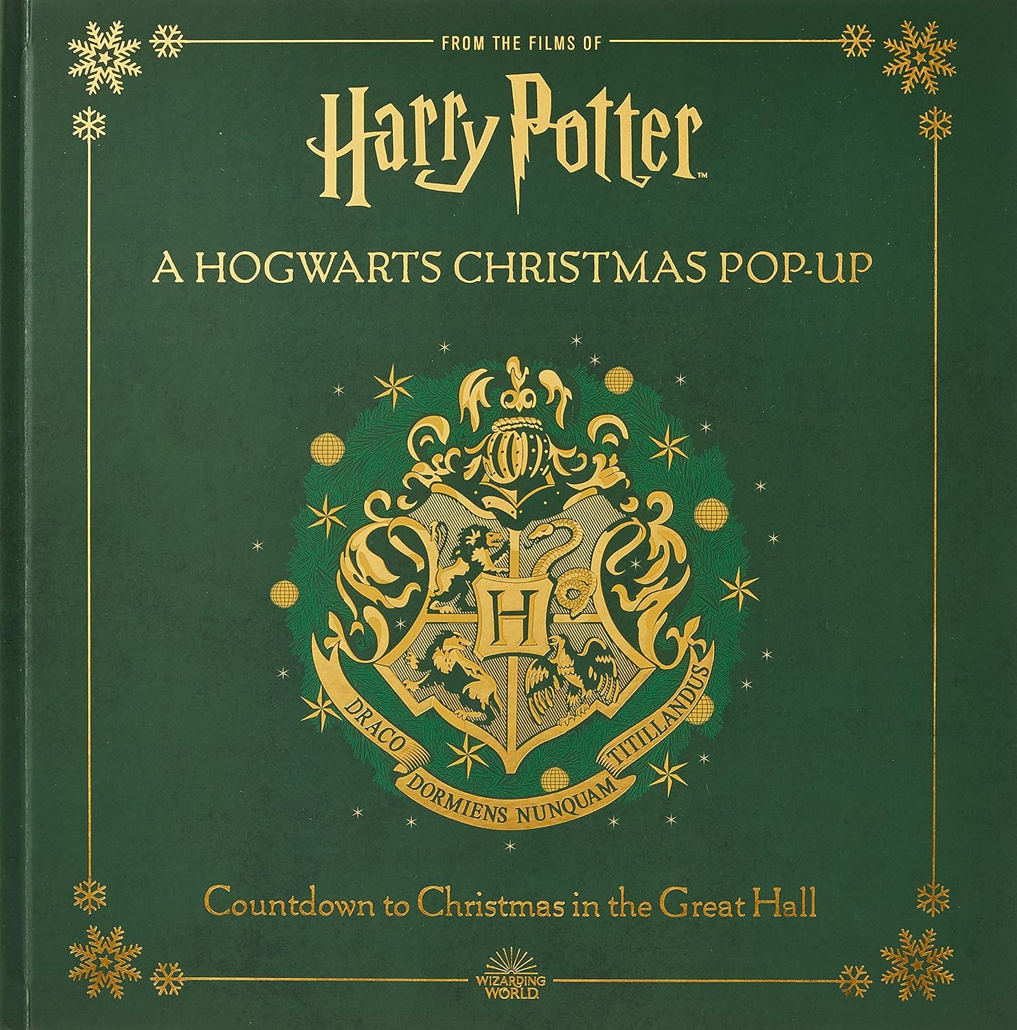 Harry Potter A Hogwarts Christmas Pop-Up hardcover book by Insight Editions showing pop-up Great Hall Christmas tree scene