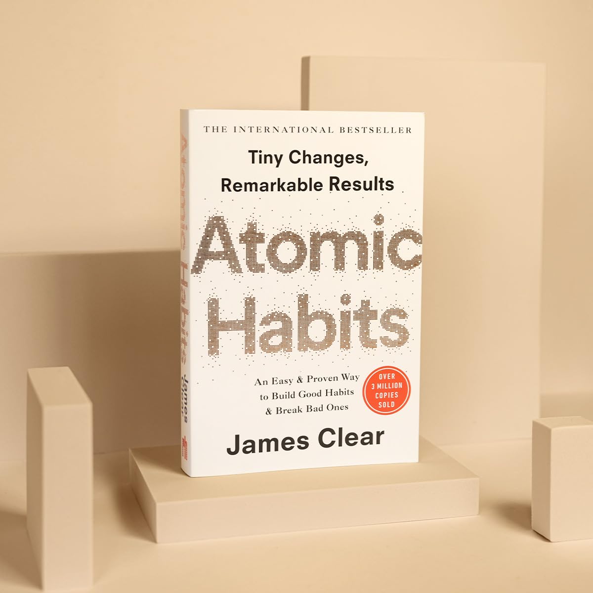 Atomic Habits by James Clear - Paperback back cover with reviews