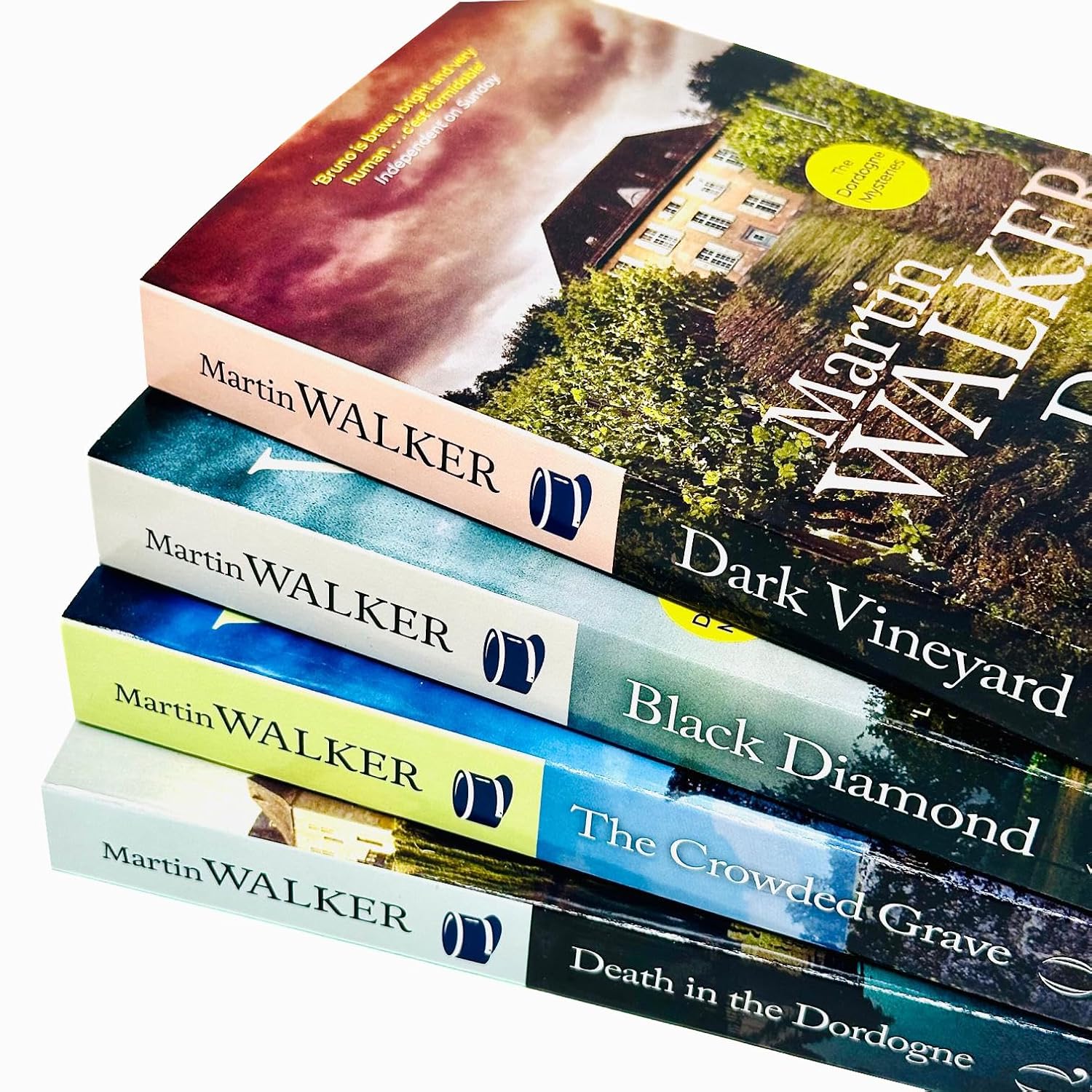 Black Diamond and The Crowded Grave paperback covers - Bruno Chief of Police Dordogne Mysteries by Martin Walker