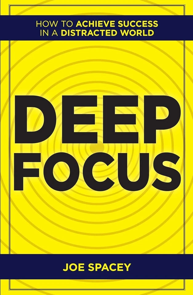 Stacked paperback copies of Deep Focus, THE ONE GOAL, and Key Strategy Tools by Joe Spacey, Patrick Rayne and Vaughan Evans