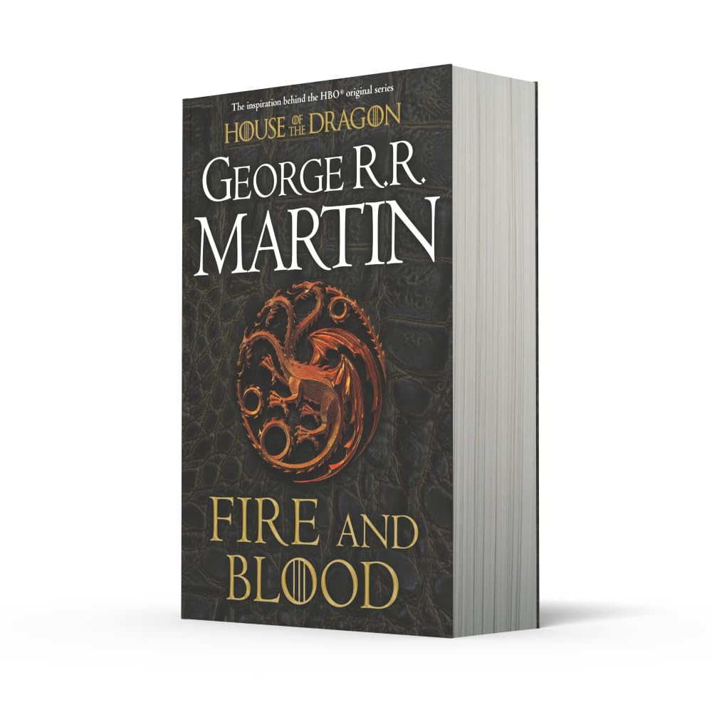 Fire and Blood by George R.R. Martin paperback back cover showing Targaryen history and HBO House of the Dragon tie-in