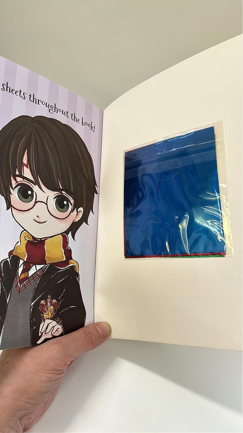 Inside pages of Harry Potter Foil Wonders Around the Wizarding World showing foil sticker scenes of Hogwarts