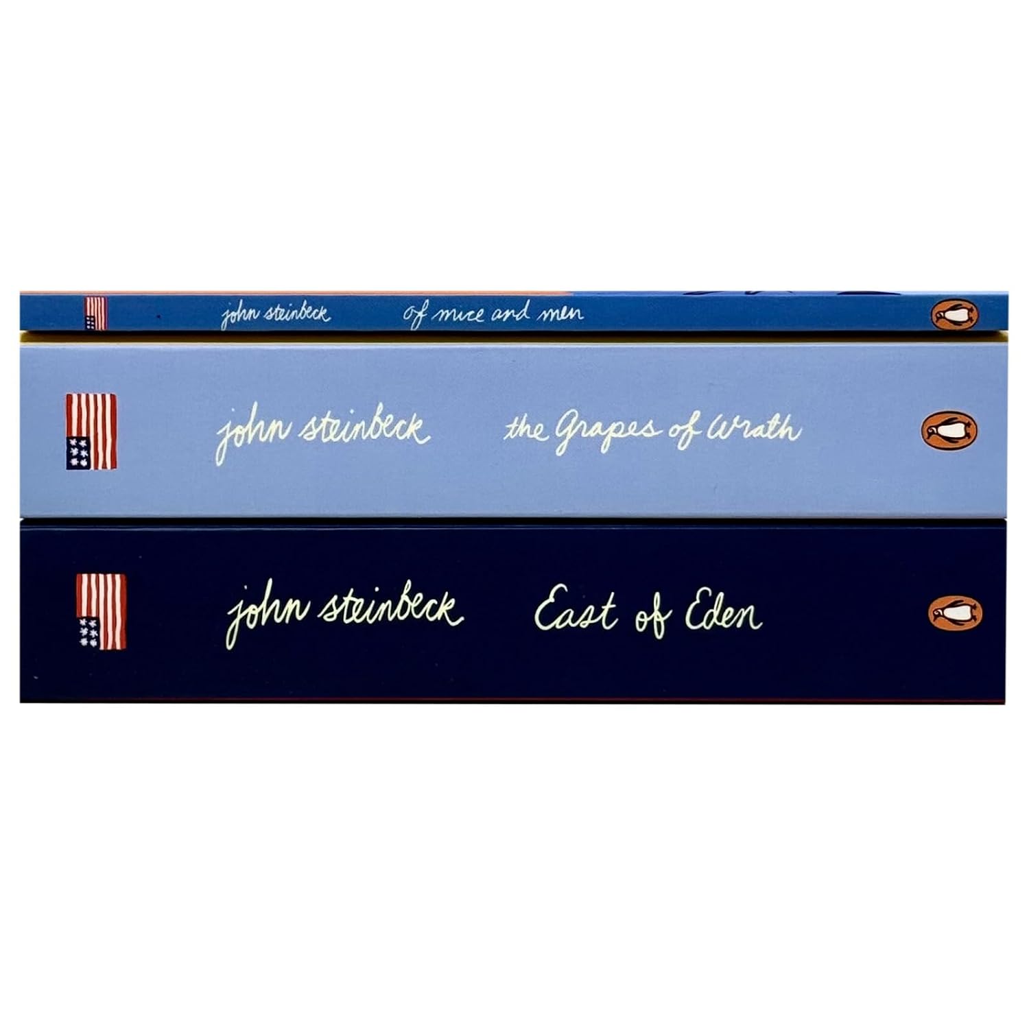 Stacked paperback copies of The Grapes of Wrath, East of Eden and Of Mice and Men by John Steinbeck