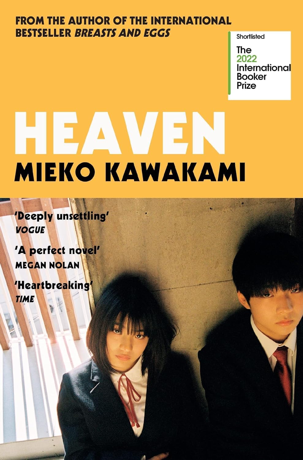Stack of Mieko Kawakami paperback novels including Heaven and Breasts and Eggs