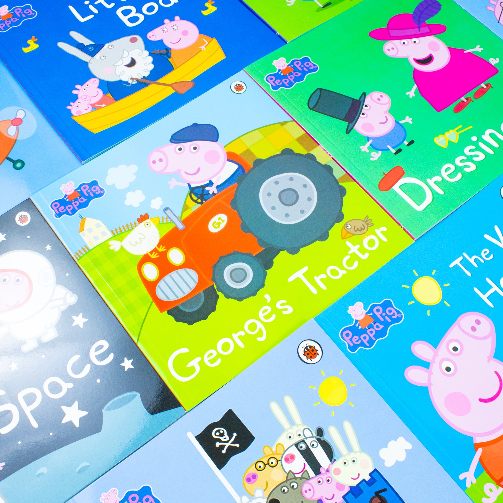 Peppa Pig 10 Books Collection Set close up of titles - George's Tractor, Dressing Up, The Picnic, Dens