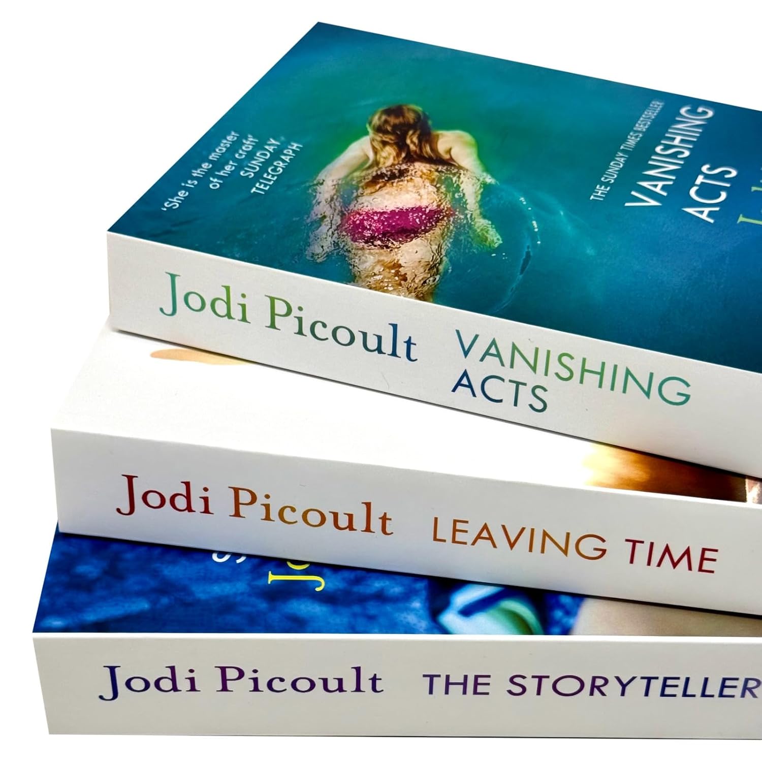 Spines of The Storyteller, Leaving Time and Vanishing Acts paperback books by Jodi Picoult