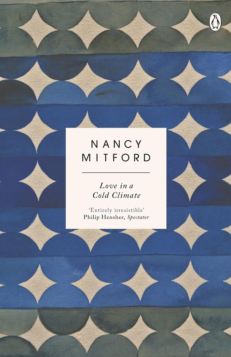 The Pursuit of Love, Love in a Cold Climate and Don't Tell Alfred paperback books by Nancy Mitford displayed together