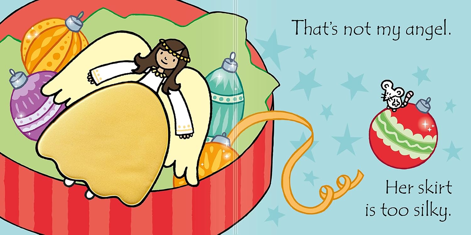 Baby exploring textured sparkly and fluffy patches in That's Not My Angel board book